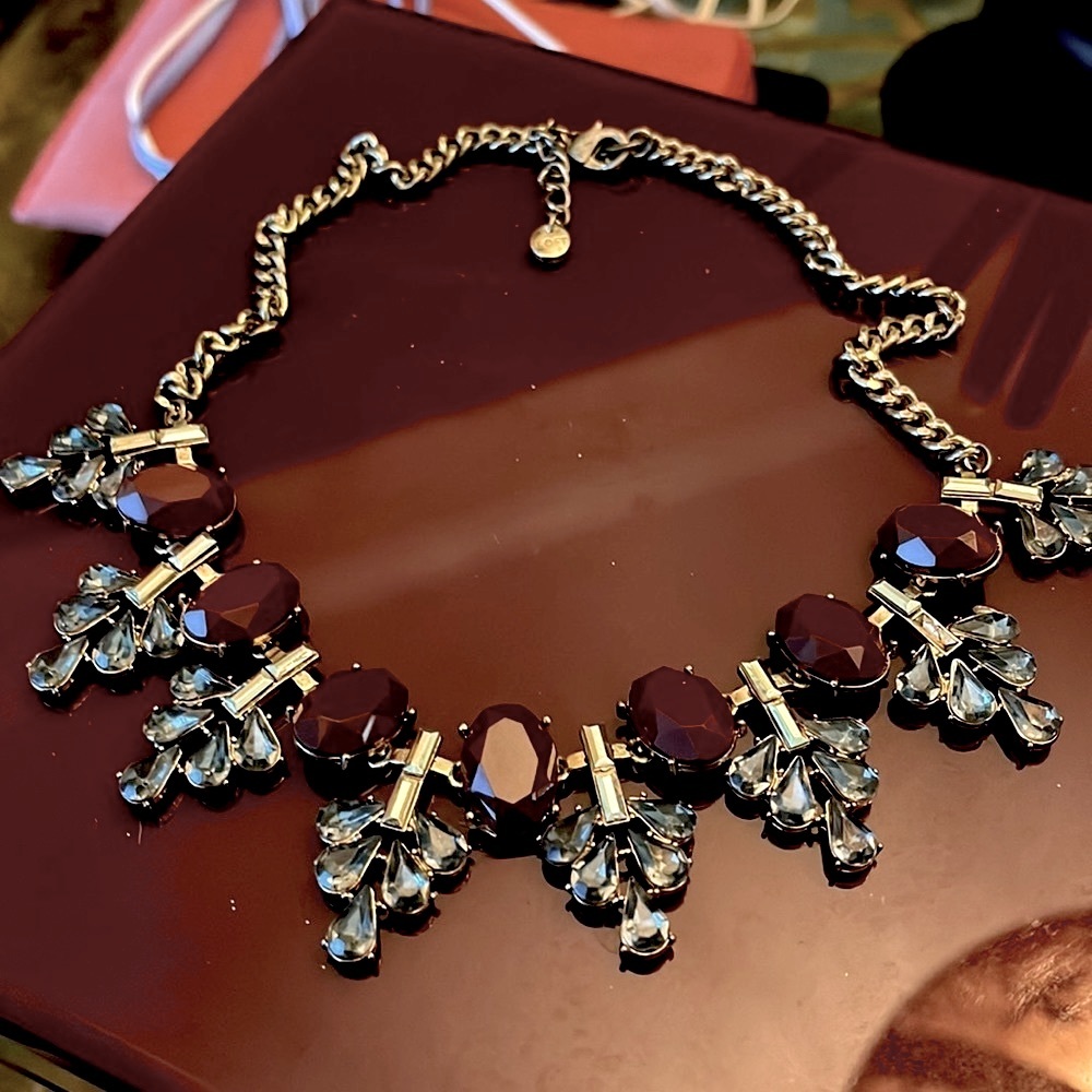 Necklace Cranberry faceted oval cabochons with grayish blue Tritons